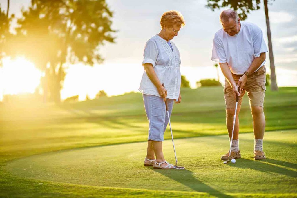 Older Couple Golfing
