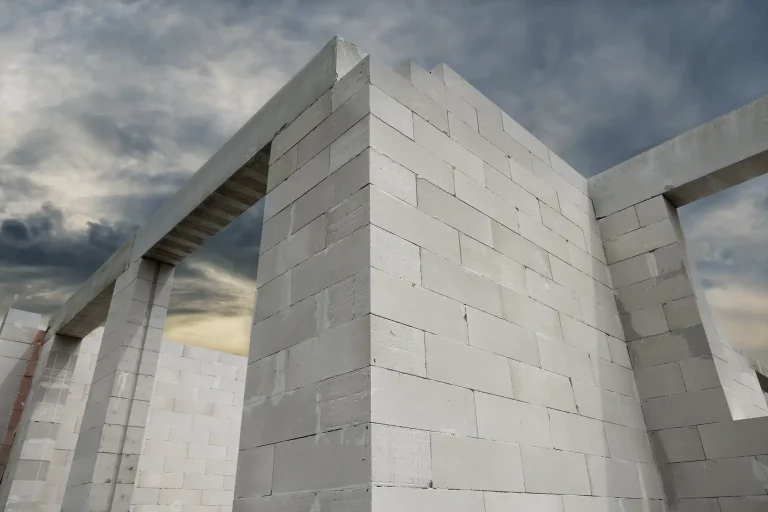 Concrete block home construction under cloudy sky in Florida